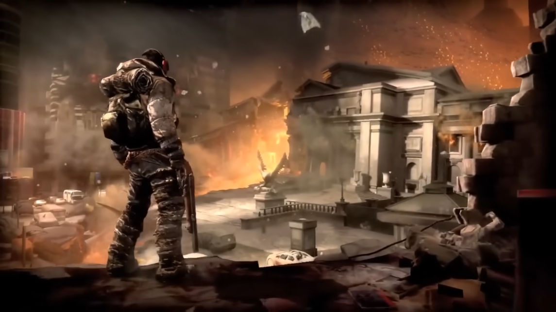 A screenshot of the cancelled Doom 4. A man in military attire holding a double-barreled shotgun stands in the foreground with his back to the camera. In the distance lays a marble town hall like building, split down the middle in flames. 