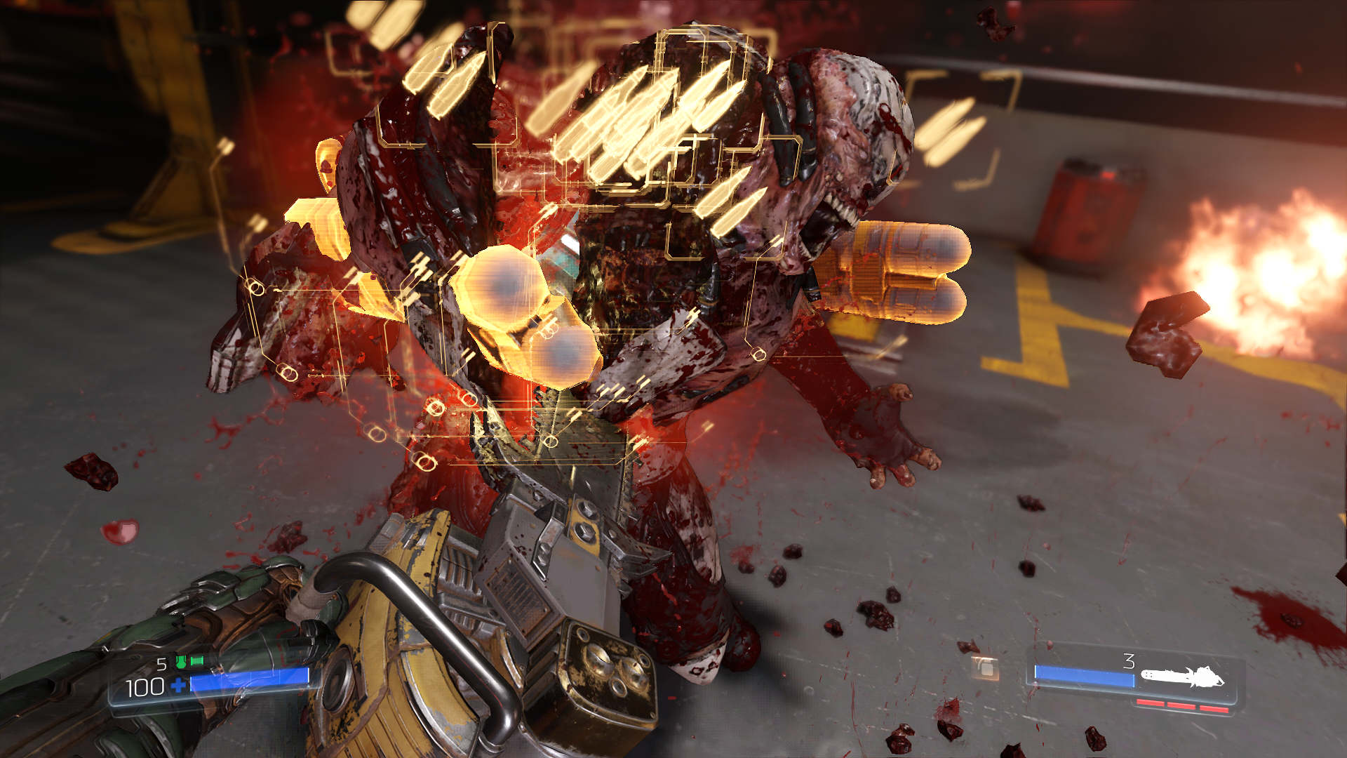 A screenshot from Doom (2016). The player cuts into an enemy with the chainsaw, with yellow ammo pickups emerging from the enemy's body