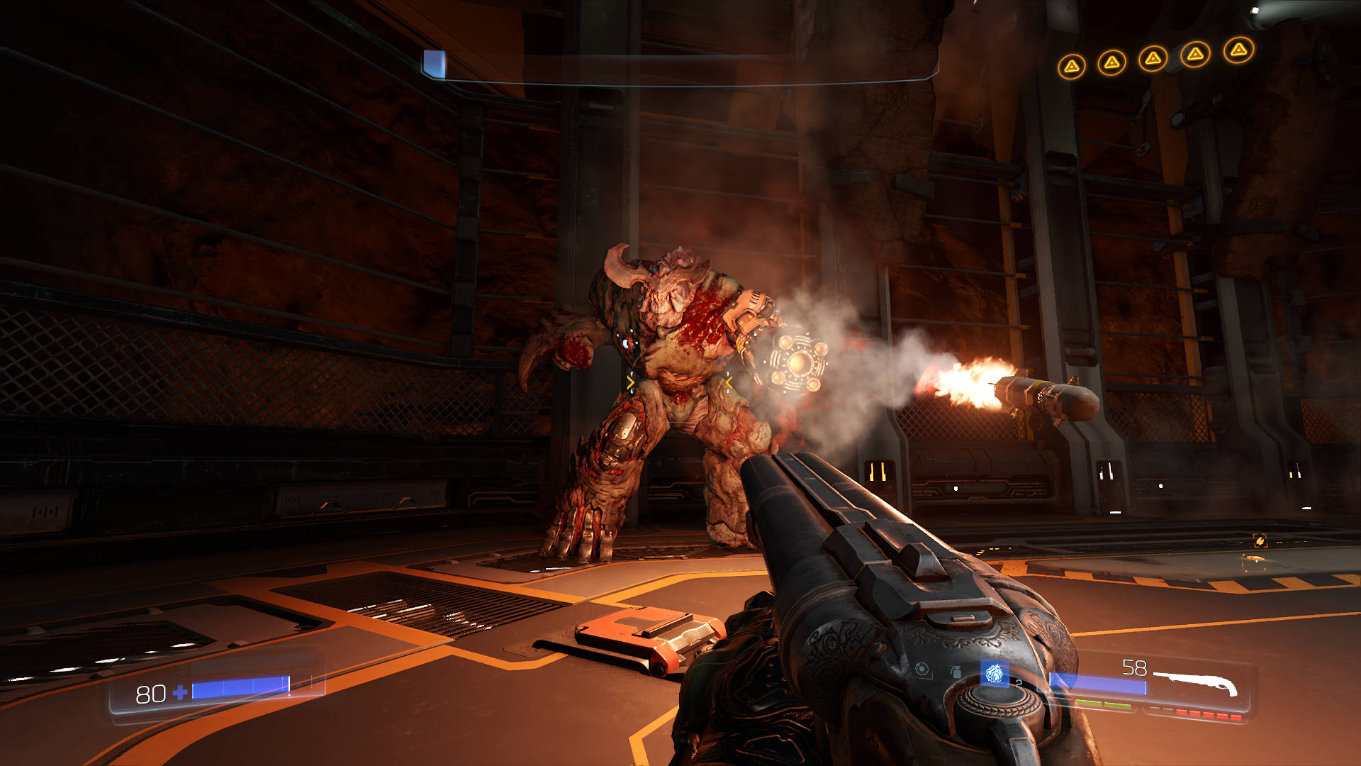 A screenshot from Doom (1993). The Cyberdemon, a massive minotaur like beast, fires missiles from its arm-cannon towards the player. There are satanically decorated pillars behind it, and the sky is a deep red.