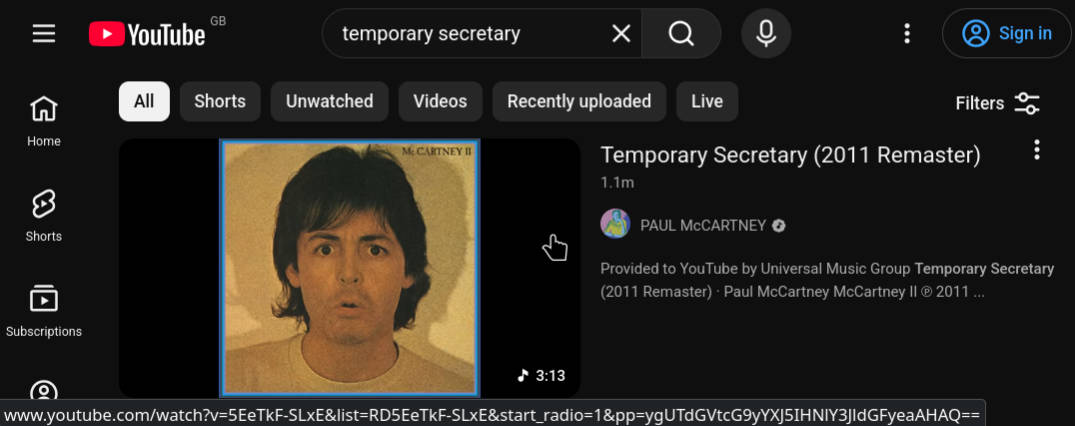A screenshot of YouTube on a computer. The cursor hovers over an upload of Paul McCartney's 'Temporary Secretary'. The bottom of the screenshot shows a verbose URL including information about a radio setting